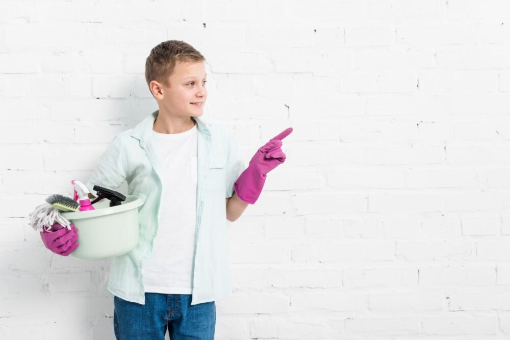 boy cleaning after party