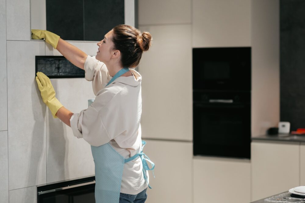 woman cleaning kitchen